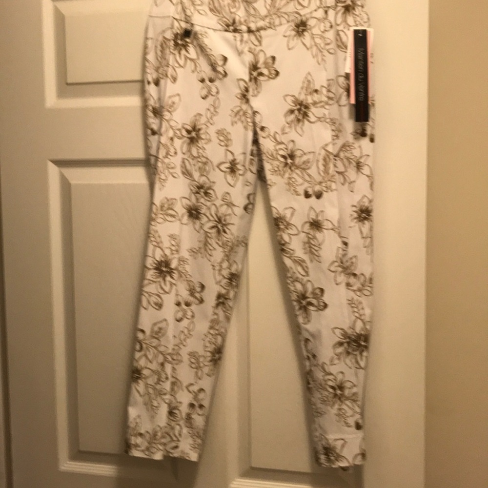 White and brown capris.